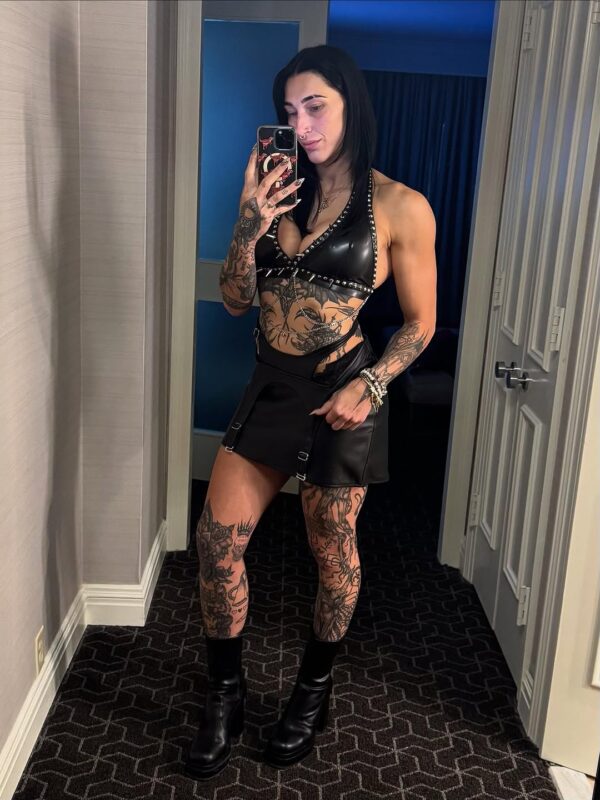 Rhea Ripley showing off her body tattoos 