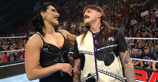 Rhea Ripley grabbing Dominik Mysterio by his neck