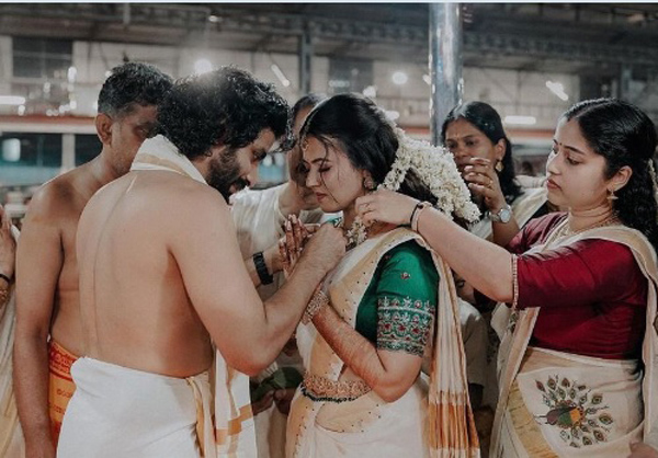 A Glimpse into the Enchanting Wedding of Aparna Das and Deepak Parambol – See Photos and Stills