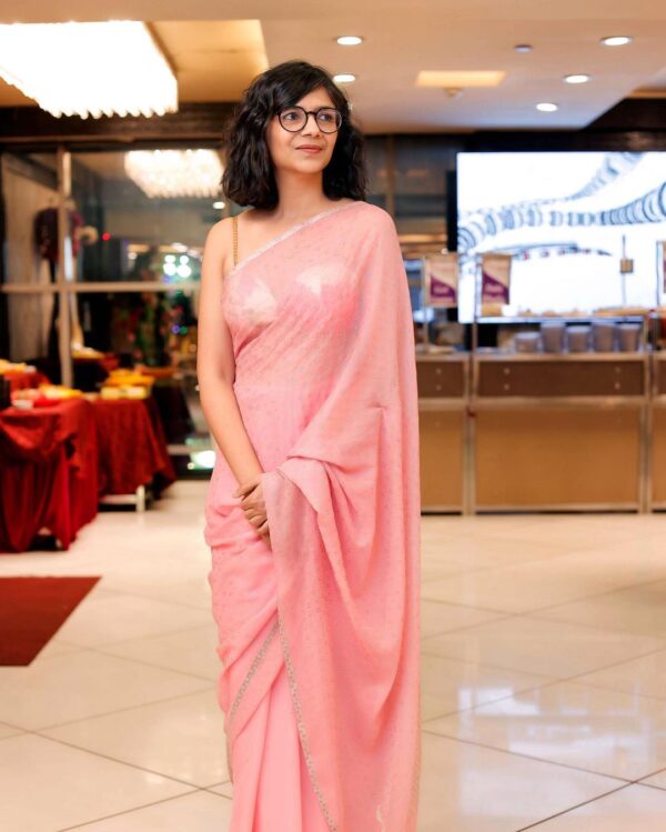 Swati Maliwal looking gorgeous donning a pink saree with curly hair 
