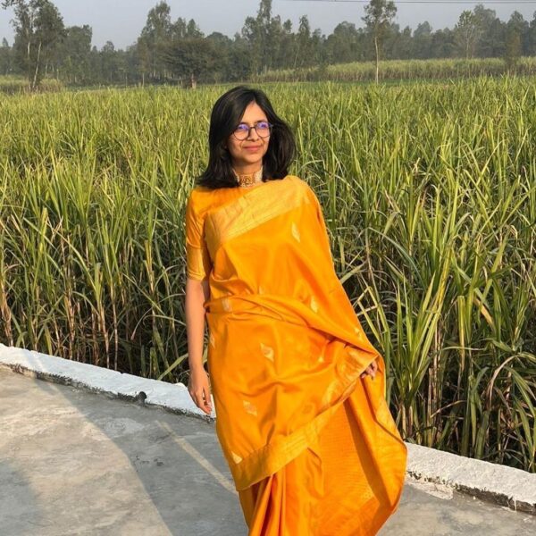 Swati Maliwal showing elegance in vibrant yellow saree