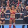 Alexa Bliss and Charlotte Flair getting their hands raised by referee on WWE SmackDown 4 July 2025 episode