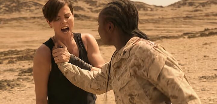 Charlize Theron getting stabbed by a Knife in The Old Guard (2020) film