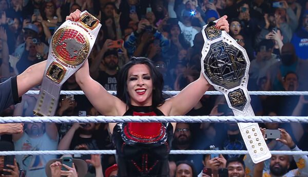 Female Pro Wrestler Stephanie Vaquer celebrating after becoming double champ at WWE NXT Roadblock 2025