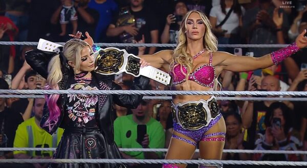 Alexa Bliss and Charlotte Flair posing inside the ring with WWE Women's Tag Team Championship on WWE RAW 4 August 2025 show
